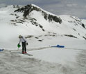 Photo of Chris Landry carrying out simulated dust effects on snowmelt.
