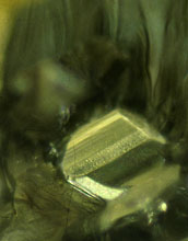 a hexagonal grain of iron sulfide that can be used to reveal the diamond's age.