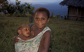 Older child carrying an infant