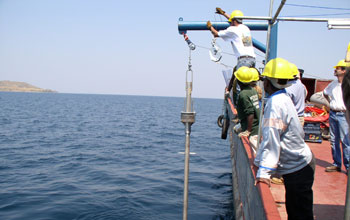 Photo of researchers conducting sediment coring to retrieve samples from Lake Tanganyika's floor.