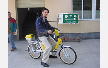 Photo shows Chris Cherry taking an e-bike for a test drive.