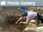 Photo of woman excavating and the words Photo Gallery