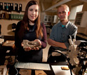 Lauren Sallan and Michael Coates handle an actinopterygian fossil in their lab.