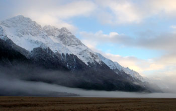Morning fog floating over a mountain prairie in New Zealand