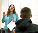 teacher in front of students in a class