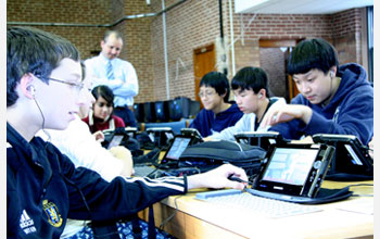 Photo of science students doing their homework by playing computer games.