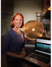 Scientist Maille Lyons with marine snow in a rotating 10-liter tank in the lab.