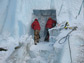 Photo of two people excavating a sampling tunnel into Taylor Glacier.