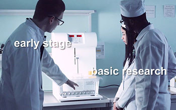 Three researchers in a lab with words early stage basic research
