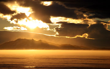 Sunlight falls on the Royal Society Range across McMurdo Sound from McMurdo Station