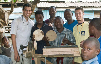 Graduate Research Fellow is shown with community members in Tanzania