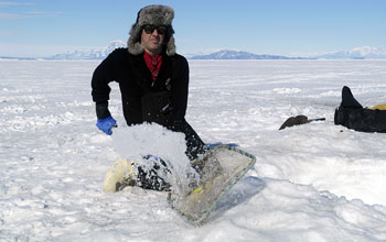 Periodically sweeping surface of dive hole  to prevent ice from re-forming