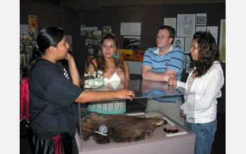 Students view items in the native cultural section of the Red River History Exhibition