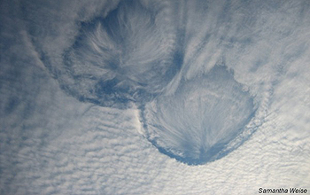 Clouds in the shape of hole-punches in the skies above Wisconsin.