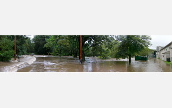 a flooded area with houses on right side.