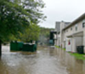 a flooded area with houses on right side.