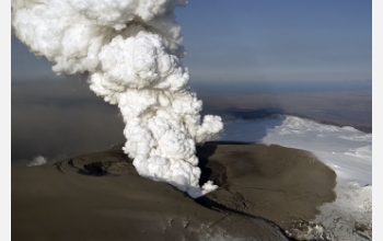 The eruption in Iceland after it penetrated Eyjafjallajökull's icecap; new ash covers the glacier.