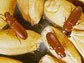 These red flour beetles are pictured on the wheat they eat and are often found near.