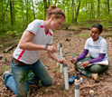 Photo of scientists Elizabeth Herndon and Danielle Andrews collecting samples.