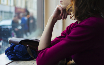 woman looking out of the window