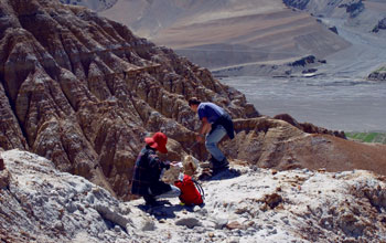 Rsearchers collect fossilized mammals teeth from a sandstone layer, Gyirong Basin, Himalayas