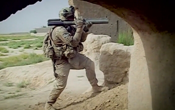 soldier standing with shoulder weapon