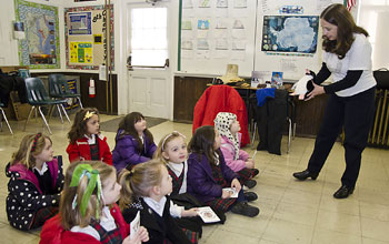 Professor teaching kids in a class about Antarctica