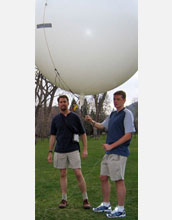 Scientists prepare to launch a balloon to test an emergency deflation system designed for the blimp.