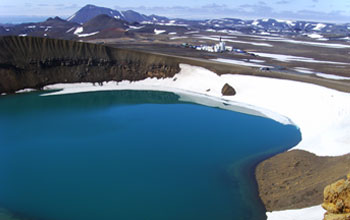 Photo of the Krafla volcano, Iceland, and drill rig across the explosion crater Viti.