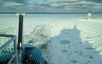 R/V Sikuliaq backs up and rams through to break snow-packed ice.