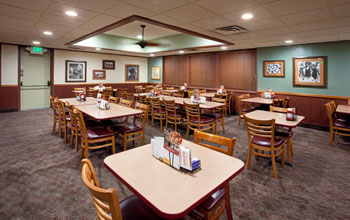 a dining room of a Denny's restaurant illuminated with Cree LR6 LED downlights.