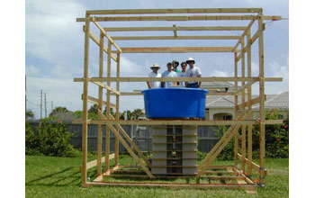 a wooden frame around the turtle pool