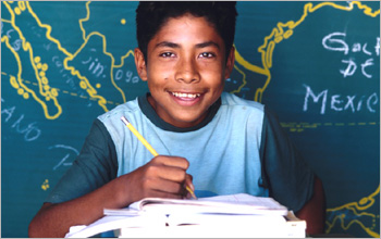 Boy in front of map.