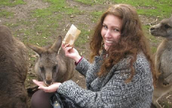 Photo of Michelle Meighan feeding a kangaroo during her summer in Tasmania.