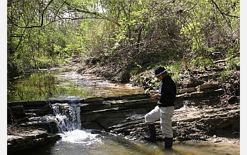 Geologist Gerta Keller looks at sediment samples along the Brazos River in Texas.