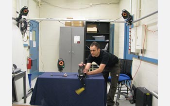Photo of Cornell University doctoral student Michael Schmidt setting up testing equipment.