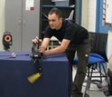 Photo of Cornell University doctoral student Michael Schmidt setting up testing equipment.