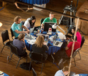 people with laptops at a table