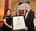 Photo of NSB's France Córdova presenting the 2011 Vannevar Bush Award to Charles Vest.