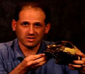 Peter Ungar of University of Arkansas holding the jawbone of Paranthropus boisei.