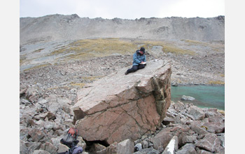 Photo of scientists using glacial debris samples to retrace ancient glaciers' paths.