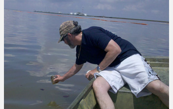 Scientists collect Gulf of Mexico oil samples for study of the oil degradation process.