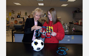 Photo of science teacher Jeanine Gelhaus discussing nanostructures with a student.