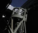 Photo of moonlight illuminating the 200-inch Hale Telescope at Palomar Observatory.