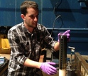 Scientist Blair Paul prepares a sediment core for further sampling