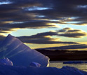 Photo of sea-ice and a cloudy sky.