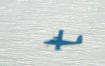 shadow of Twin Otter aircraft