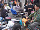 Photo of people riding electric bikes in China.