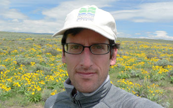 Biologist Peter Adler at a field research site.