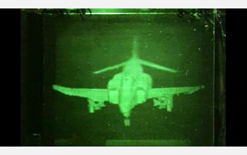 Holographic image of a F-4 fighter jet in the photo-refractive polymer screen.